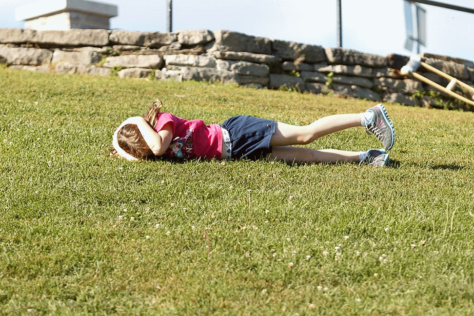 Melanie rolling down the hill at the Arboretum in Ottawa
