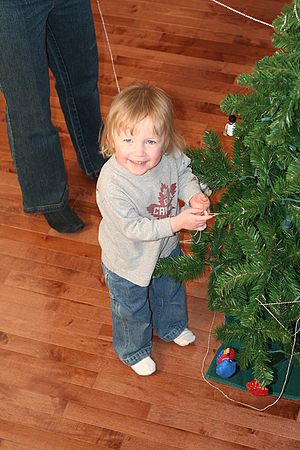 Melanie helping to decorate the Christmas Tree