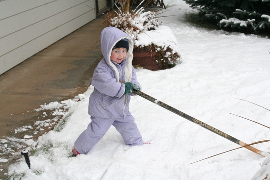 Melanie plays with Daddy's old hockey stick\n(Christmas Eve)