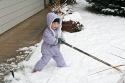 Melanie plays with Daddy's old hockey stick\n(Christmas Eve)